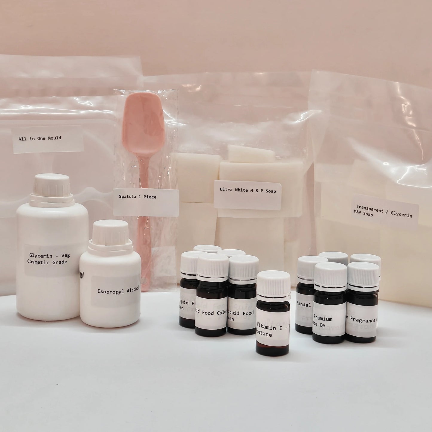 Assorted cosmetic bottles and packaging on a light pink background