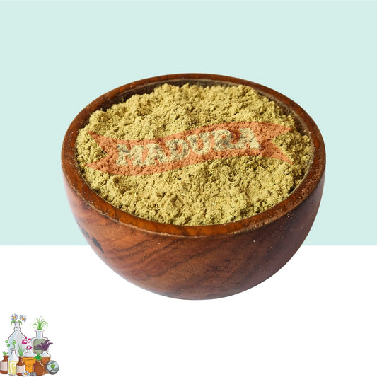 Wooden bowl filled with Marikolunthu Powder on a light blue background