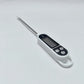 Digital thermometer with a long probe on a white background