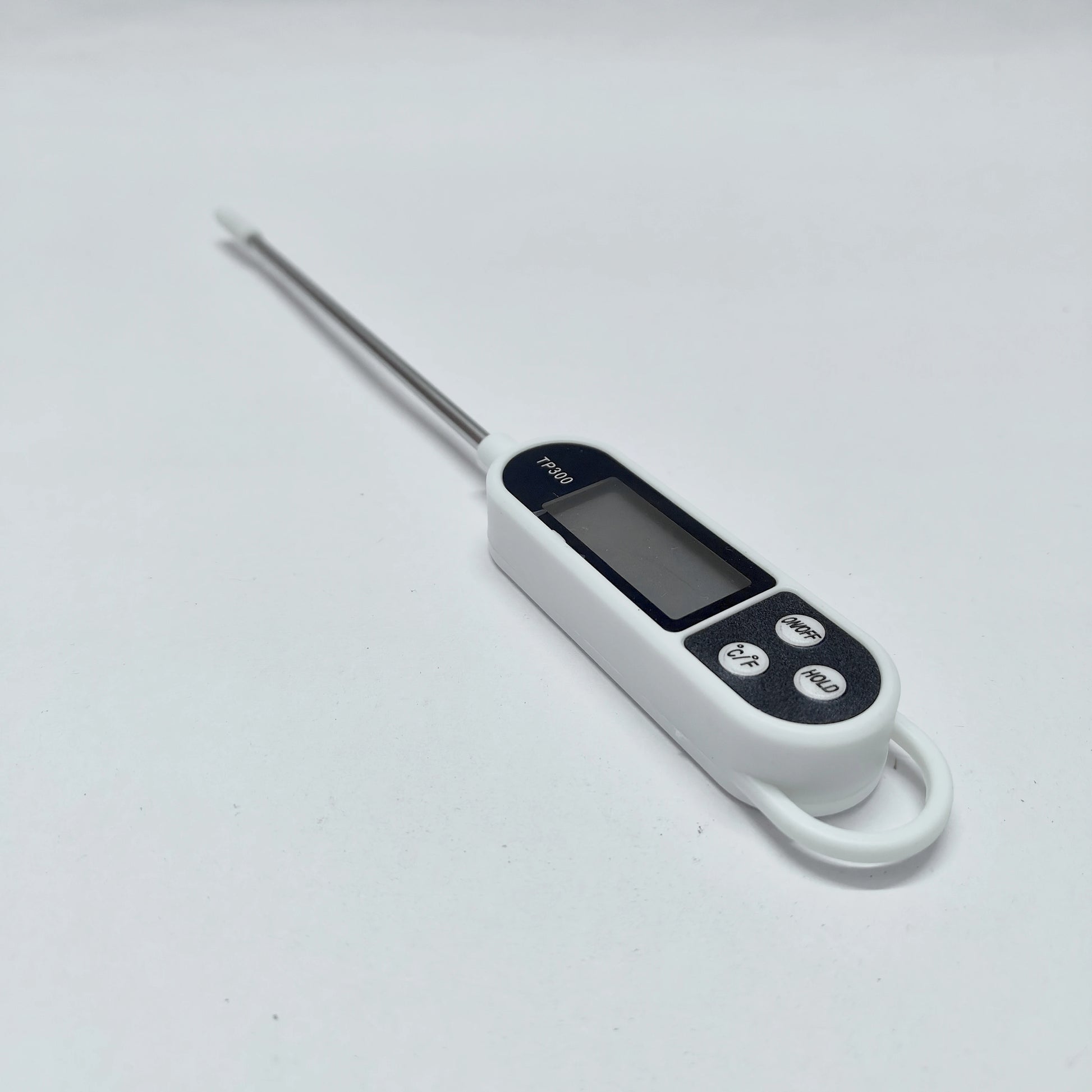 Digital thermometer with a long probe on a white background