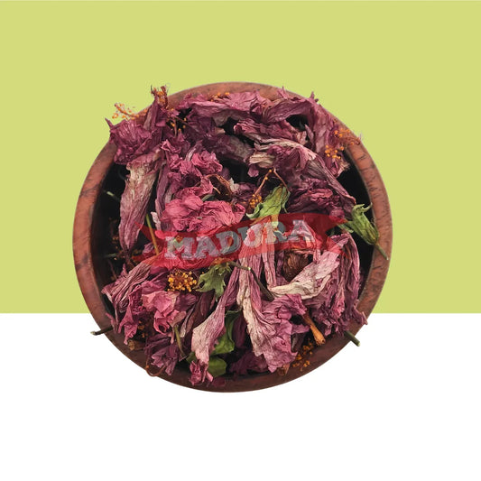 Dried Indian hibiscus flowers in a wooden bowl .