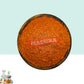 A wooden bowl with Manjista  Scrub Powder with White and Blue Background