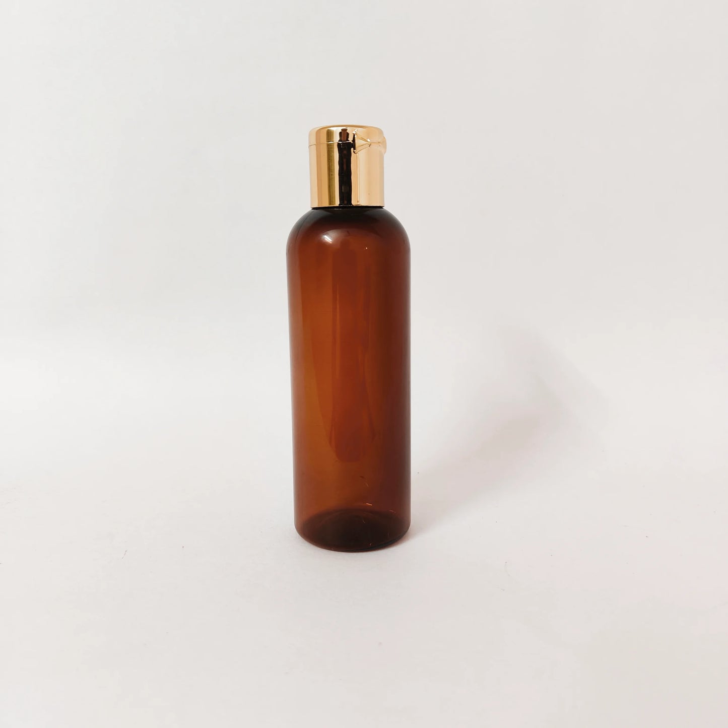 PET Round Bottle - Amber - 20mm Gold Flip Cap - 100mL