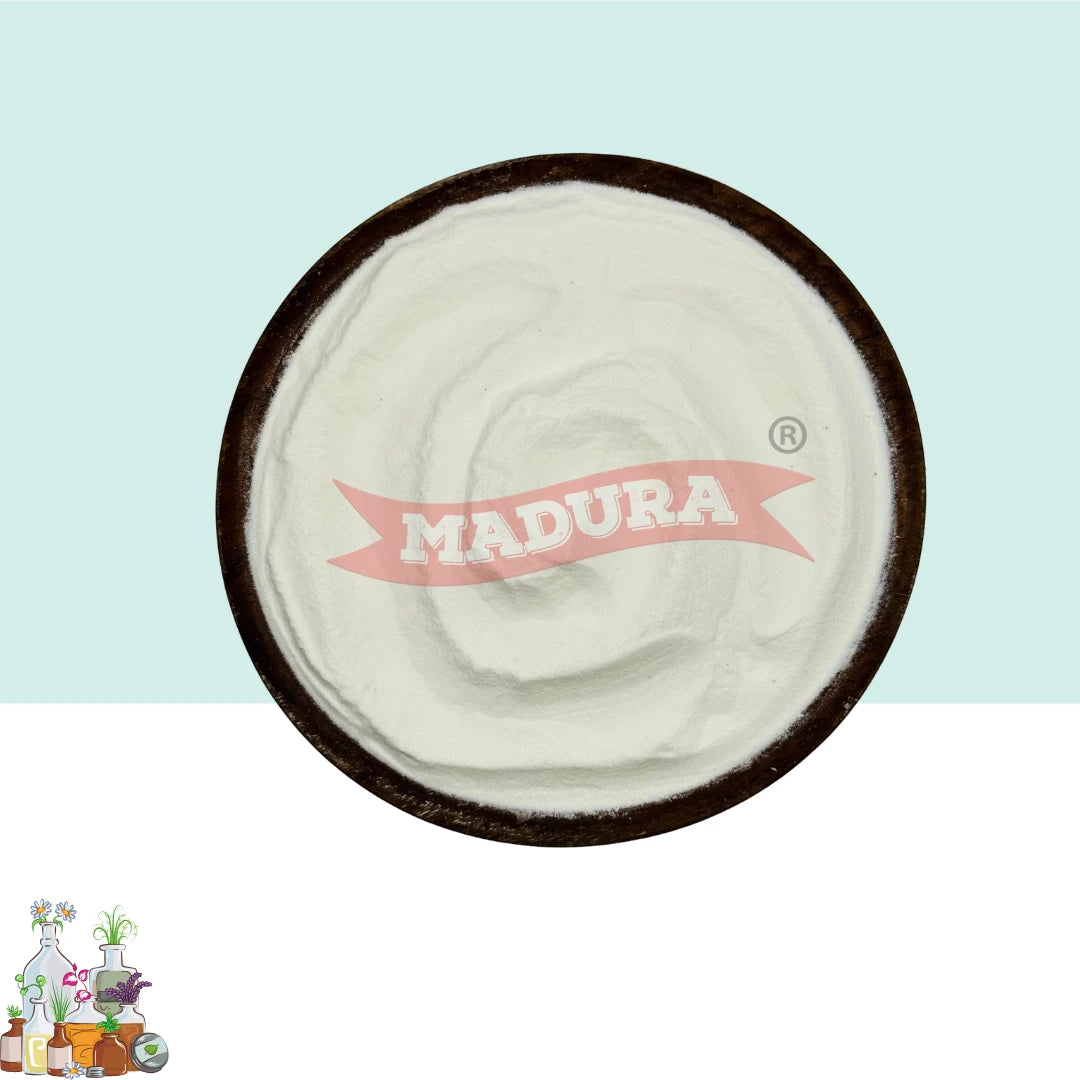 A top-down view of a white Papaya rawpowder  placed in a dark round bowl. The powder has a red watermark reading 'MADURA' across the center.