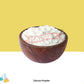 Wooden bowl filled with talcum powder on a yellow background